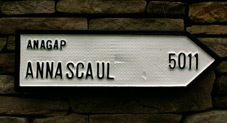 Irish road sign pointing to the area of Anagap in the parish of Annascaul in County Kerry, the mileage reflects the distance in a straight line from San Francisco to Anagap