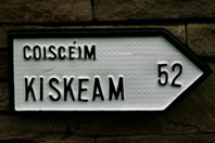 Irish Road sign for Kiskeam (Coisceim) village in County Cork
